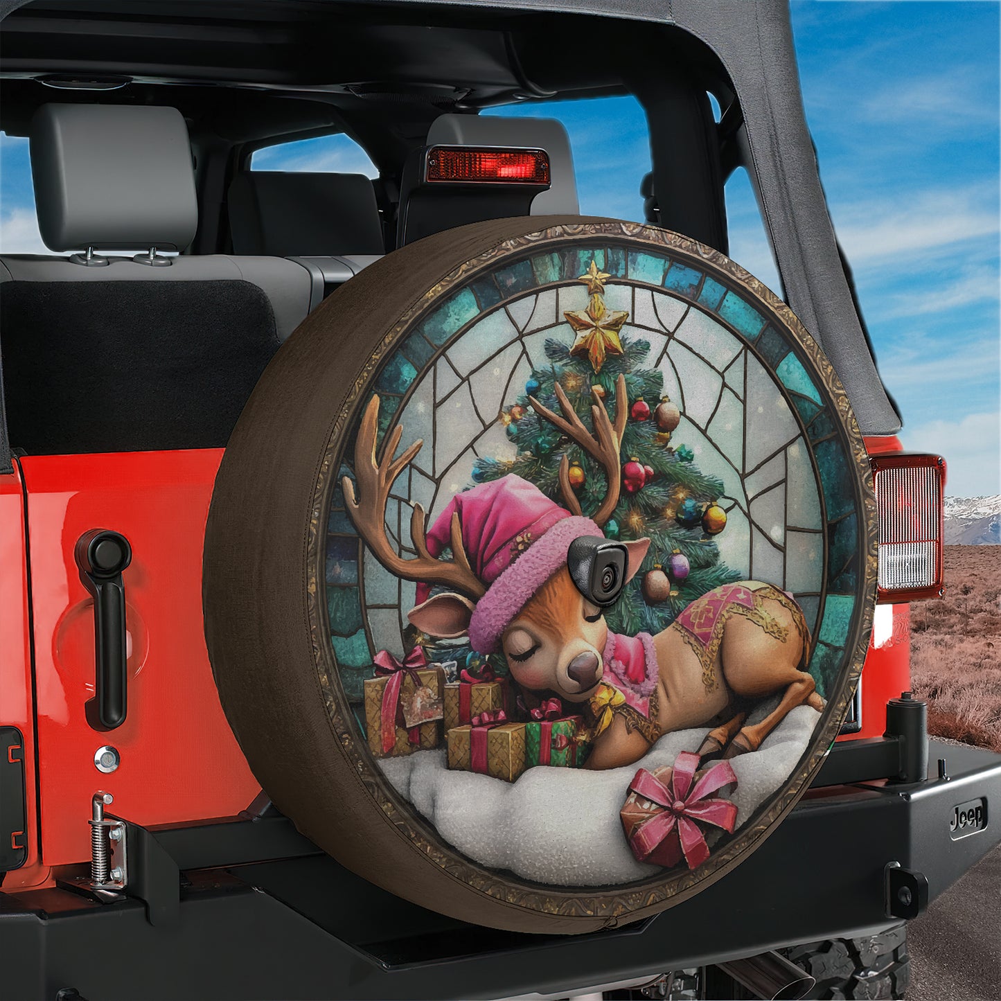 a decorated tire cover with a picture of a christmas tree